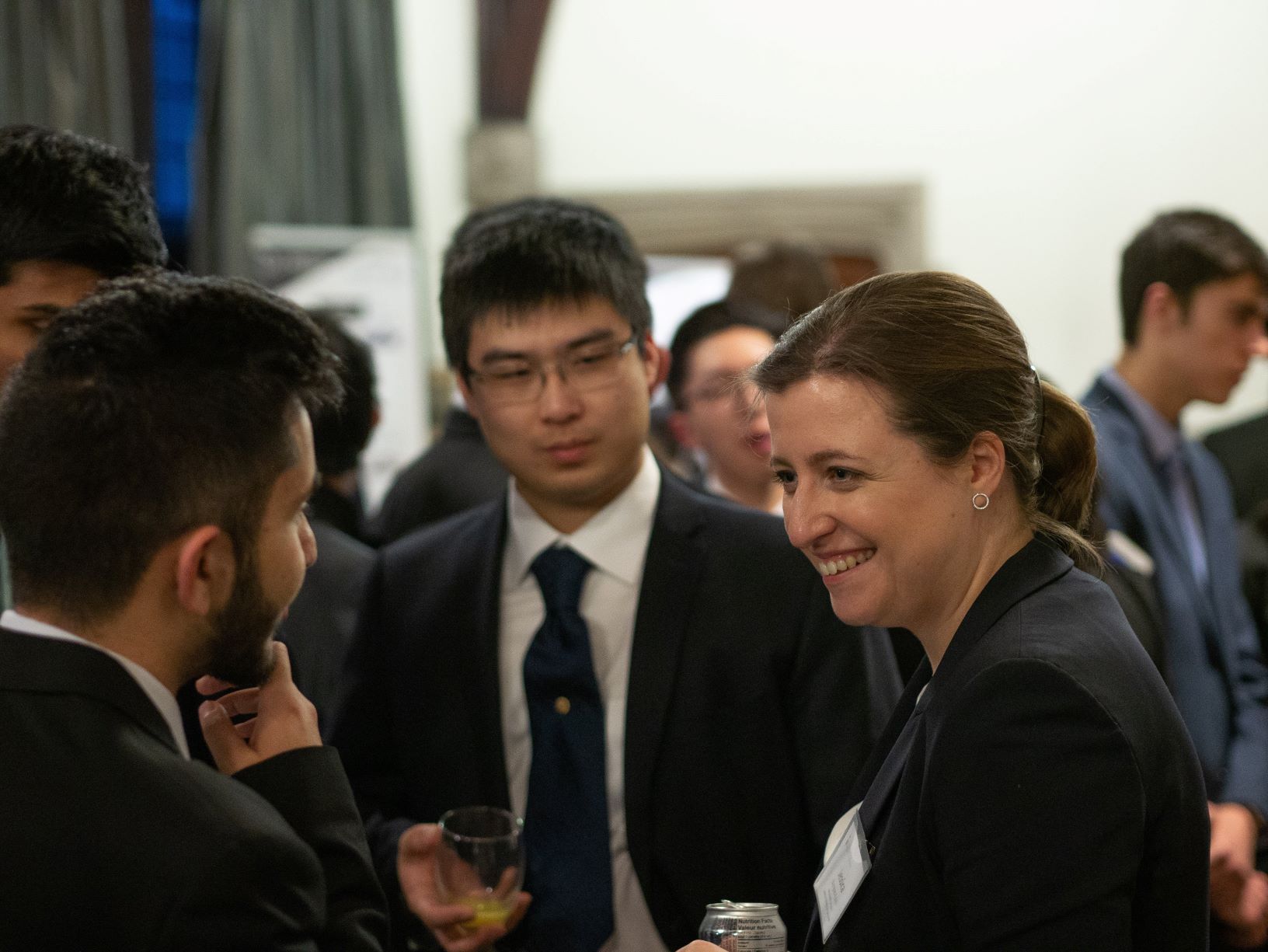 students chatting with an ESEC speaker at the 2019 conference reception