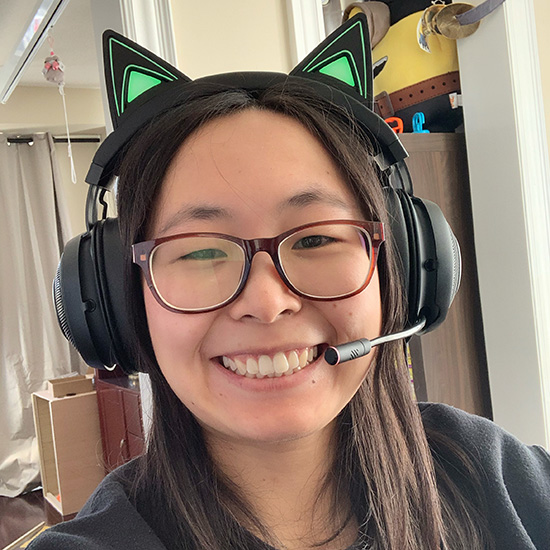 photo of Xinyue Crystal Liu smiling to camera, wearing headhpone with cat ears