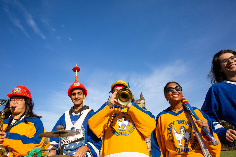 members of the lady godiva memorial band playing on the front campus on a sunny day